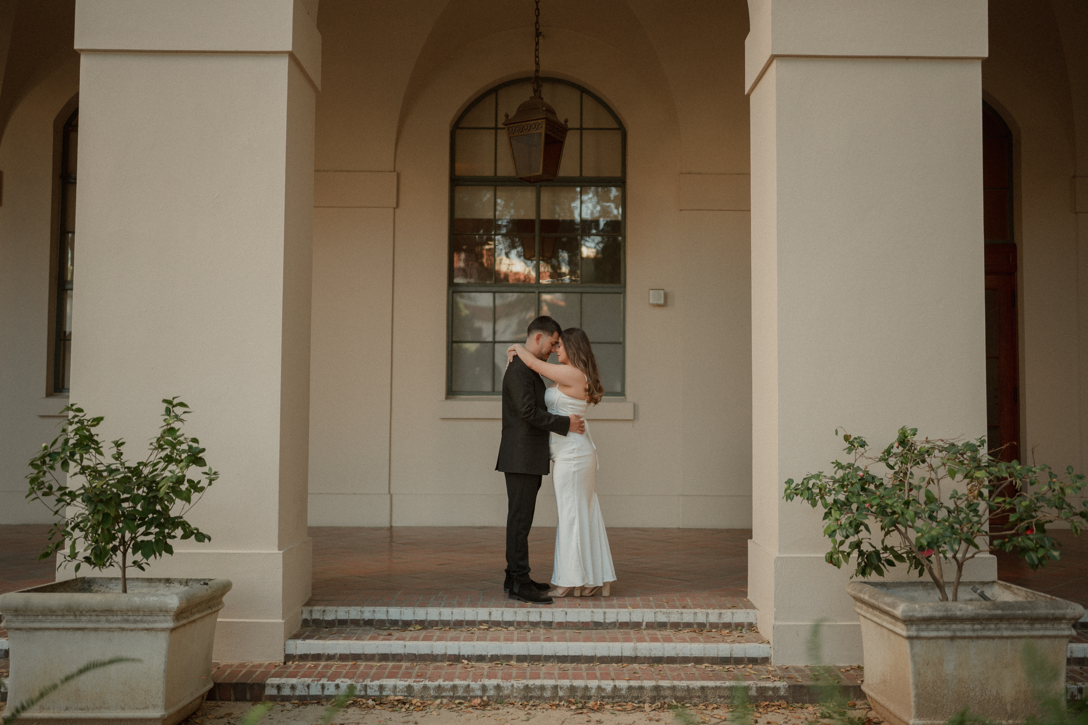 Christine and Rudy sitting and kissing
